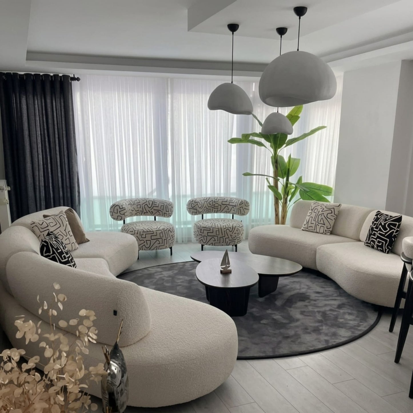 Serenity Integrated Living Set | Curved Bouclé Sectional & "Grafika" Accent Chairs | Rhaya Furniture
