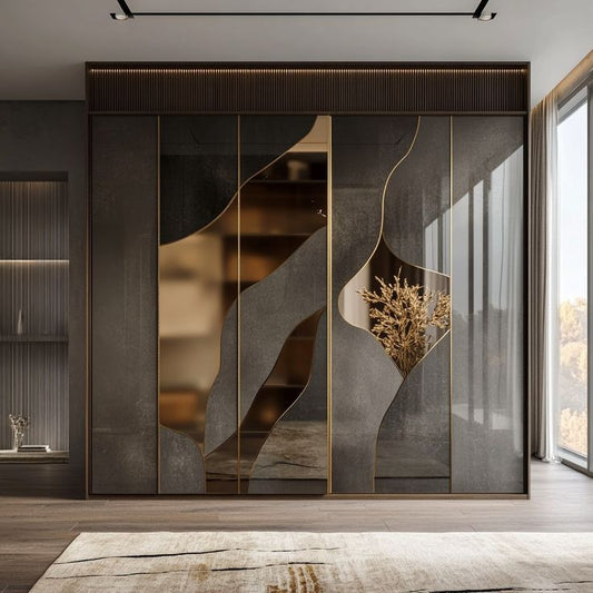 Modern sliding wardrobe featuring dark grey stone panels with organic curved bronze mirror inlays for bedroom storage.
